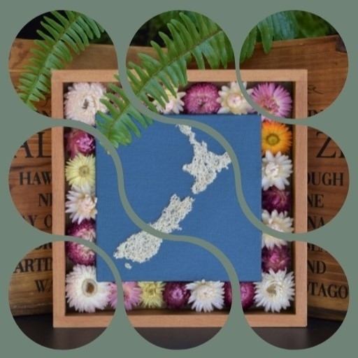 A picture made from loofah fiber in crafting with dried flowers surrounding