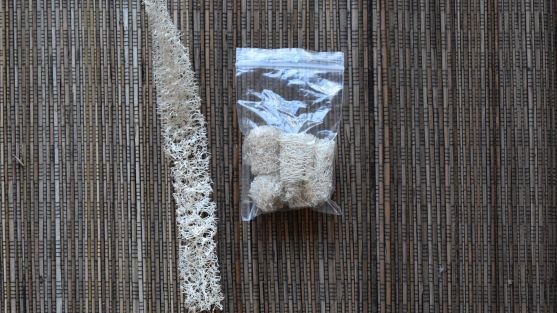 Condensed loofah pieces for camping fires
